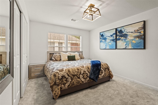 bedroom with light colored carpet