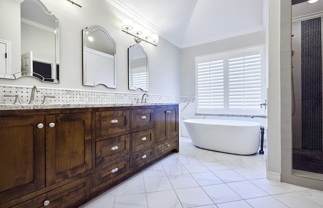 bathroom featuring vanity, crown molding, vaulted ceiling, and separate shower and tub