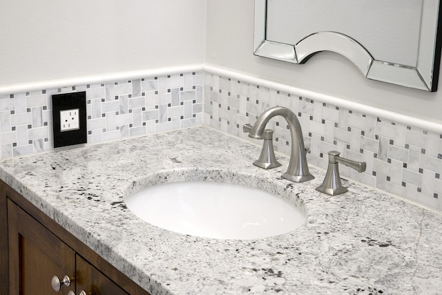 interior details featuring tasteful backsplash and vanity