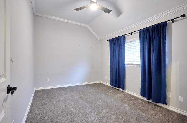 empty room with ceiling fan, carpet, ornamental molding, and vaulted ceiling