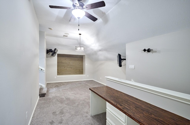 bathroom with ceiling fan and vaulted ceiling