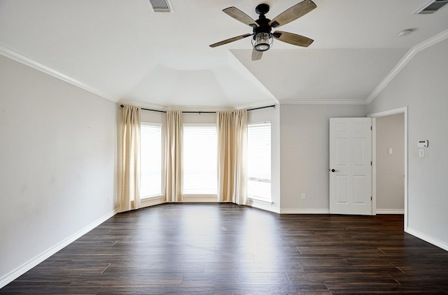 spare room featuring ceiling fan, vaulted ceiling, crown molding, and dark hardwood / wood-style floors