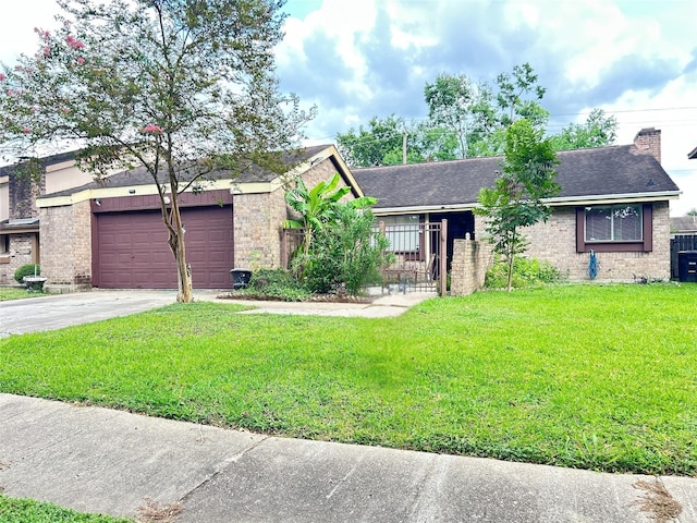 view of front of property with a garage and a front yard