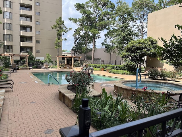 view of pool featuring a community hot tub