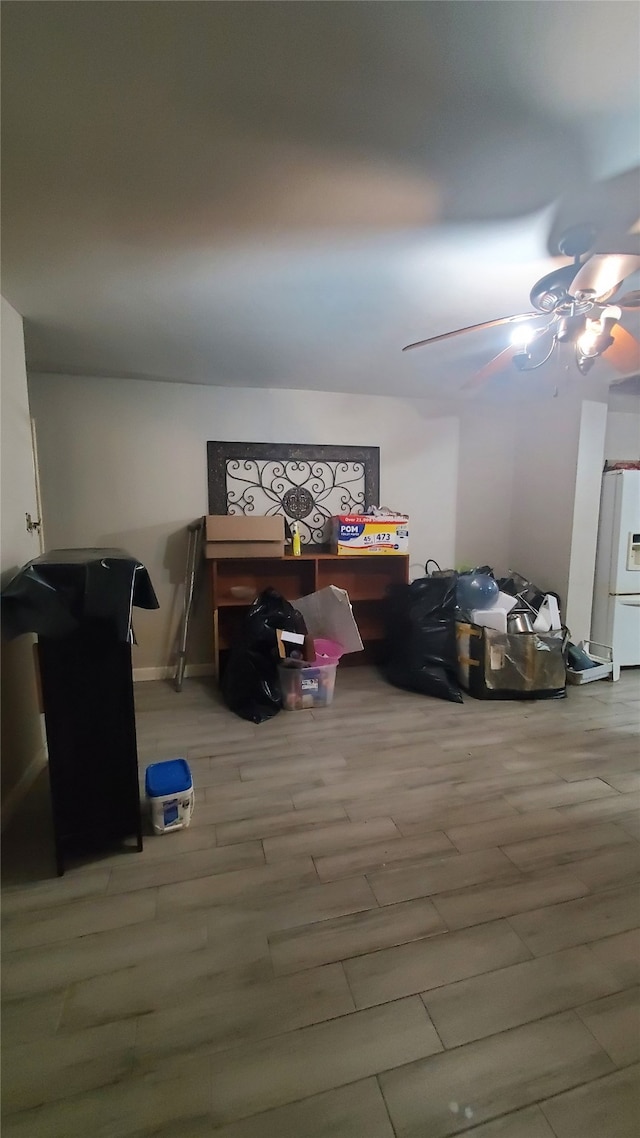 additional living space featuring hardwood / wood-style floors and ceiling fan