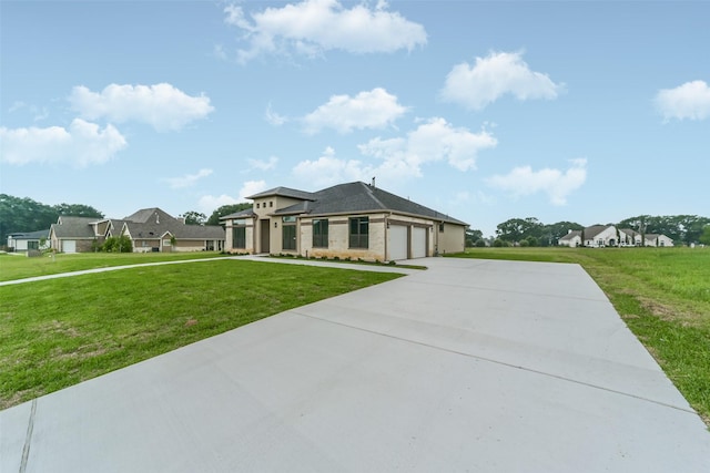 view of front facade featuring a garage and a front lawn