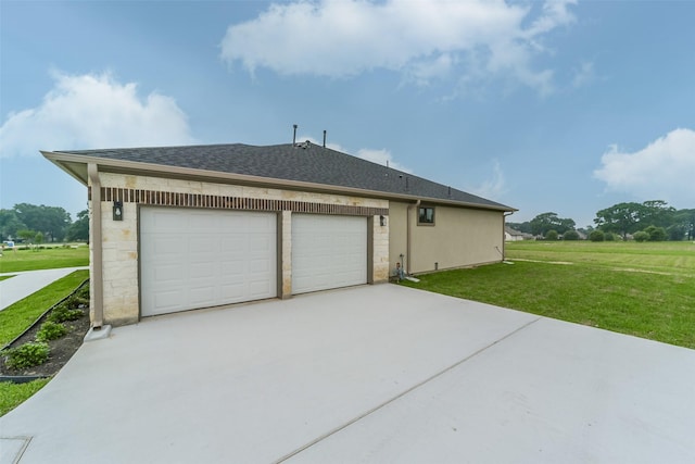 exterior space featuring a yard and a garage