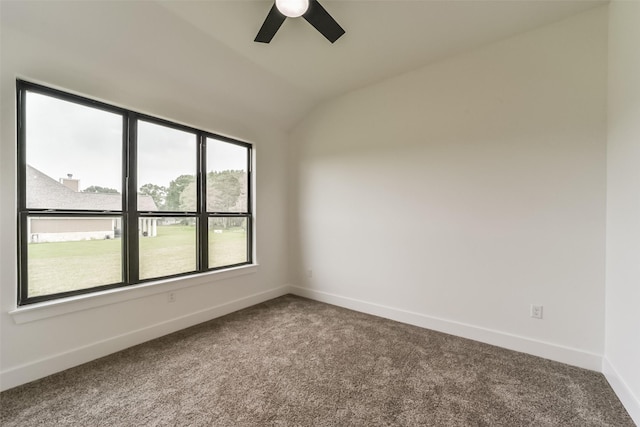 carpeted empty room featuring ceiling fan and vaulted ceiling