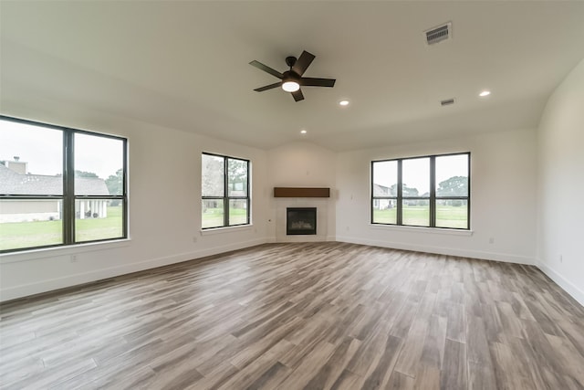 unfurnished living room with ceiling fan and light hardwood / wood-style flooring