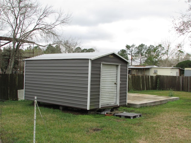 view of outdoor structure featuring a lawn