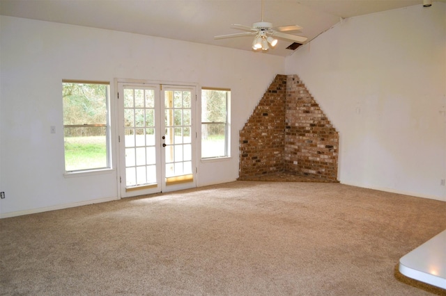 unfurnished living room with ceiling fan, lofted ceiling, and carpet floors