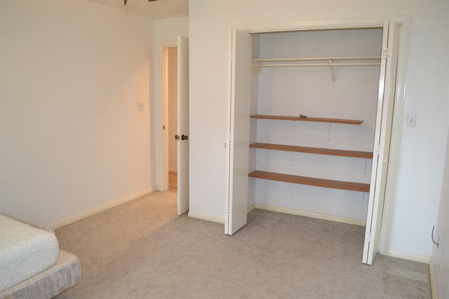 carpeted bedroom with a closet