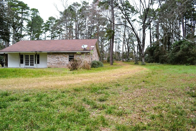 view of yard with french doors