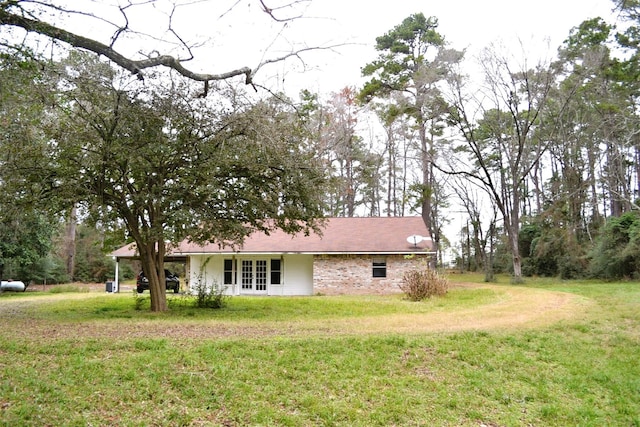 exterior space with a front yard