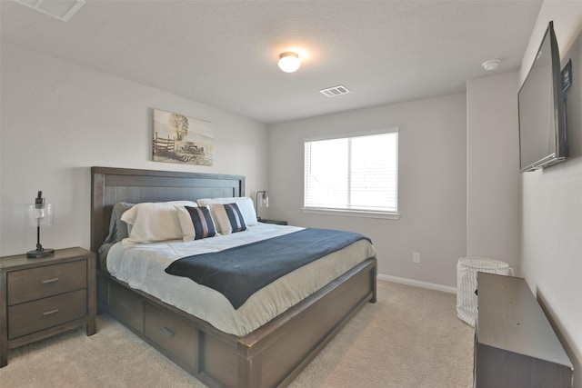 bedroom featuring light carpet