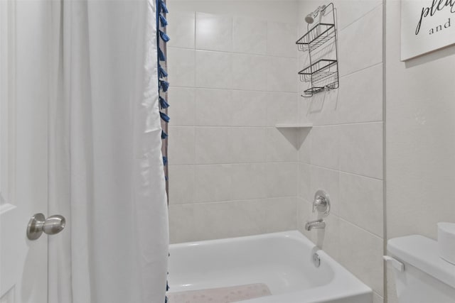 bathroom featuring toilet and shower / tub combo with curtain