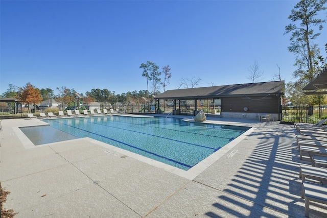 view of swimming pool with a patio area