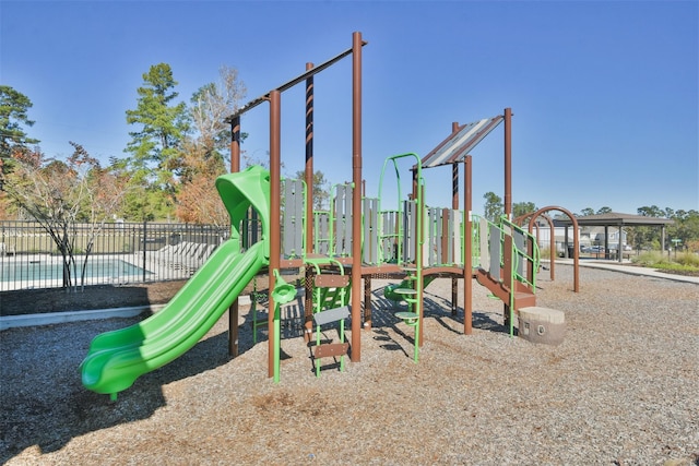 view of play area featuring a fenced in pool