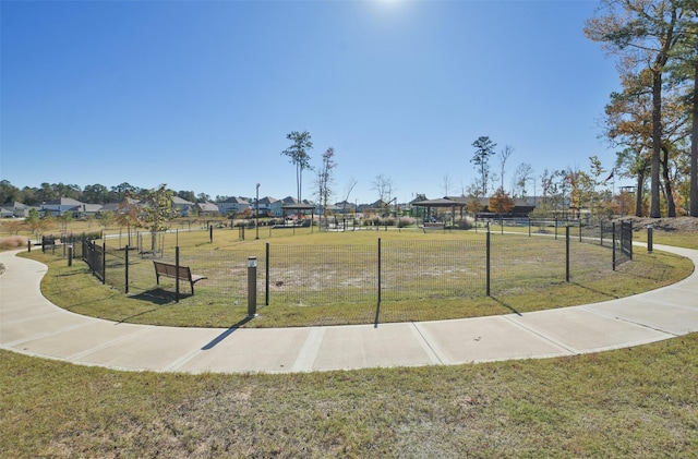 view of property's community featuring a lawn