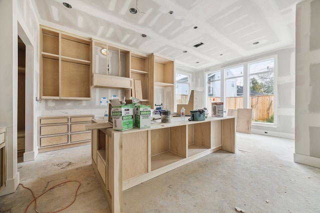 kitchen featuring light brown cabinets