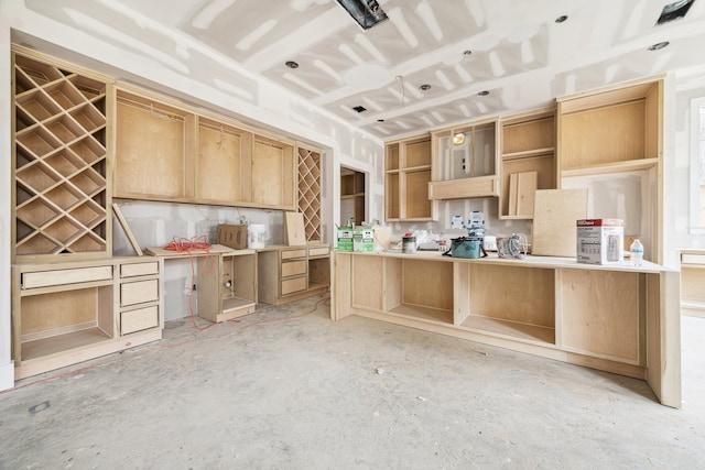 kitchen featuring light brown cabinetry