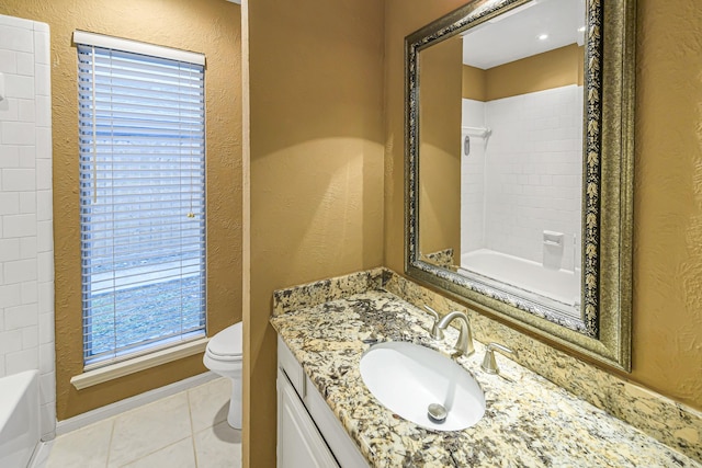 bathroom with vanity, tile patterned floors, and toilet