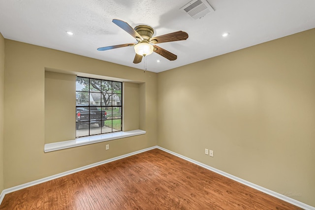 unfurnished room featuring ceiling fan and wood-type flooring