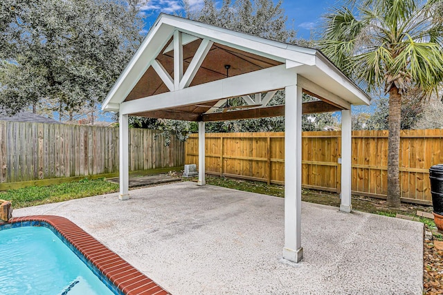 view of patio with a gazebo and a fenced in pool