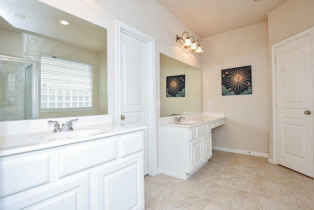 bathroom with a shower with shower door and vanity