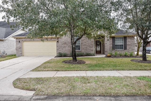 view of property hidden behind natural elements with a garage and a front yard