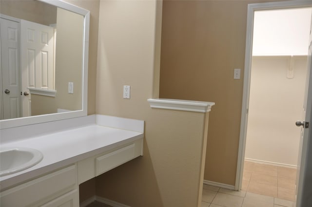 bathroom with tile patterned flooring and vanity