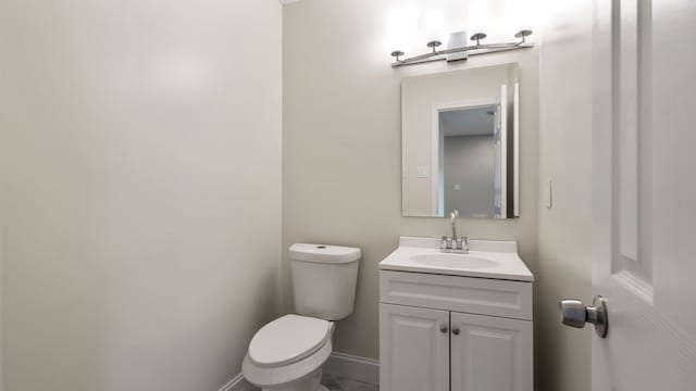 bathroom with toilet and vanity