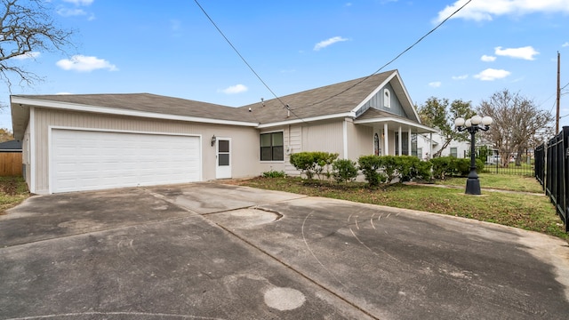 view of front of home with a front yard and a garage