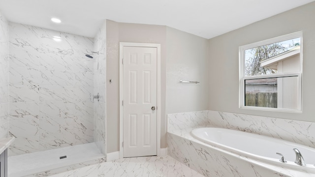 bathroom featuring separate shower and tub