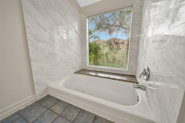 bathroom featuring a bathtub and tile patterned floors