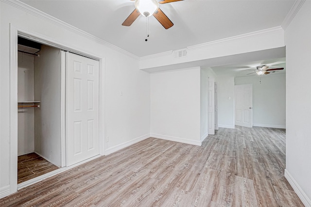 spare room with ornamental molding, ceiling fan, and light hardwood / wood-style flooring