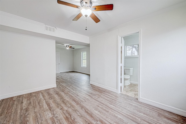 unfurnished room with ceiling fan, light hardwood / wood-style floors, and crown molding