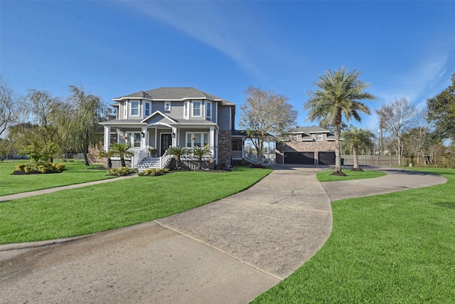 view of front of home featuring a front yard and covered porch