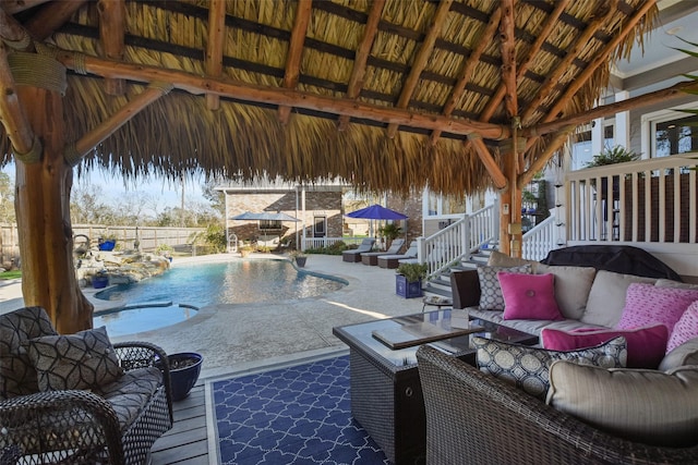 view of pool featuring a gazebo, outdoor lounge area, and a patio