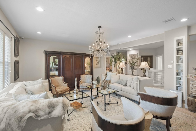 living room featuring built in features and a notable chandelier