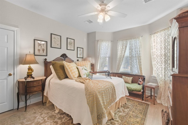 bedroom featuring ceiling fan and light hardwood / wood-style floors