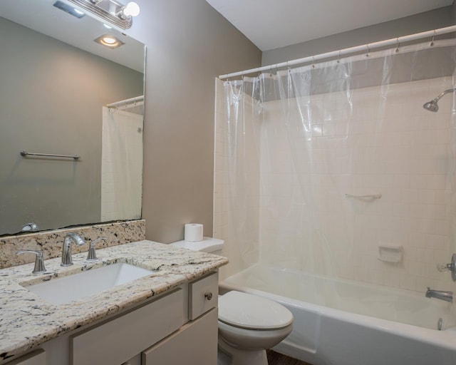 full bathroom featuring toilet, shower / bath combo, and vanity