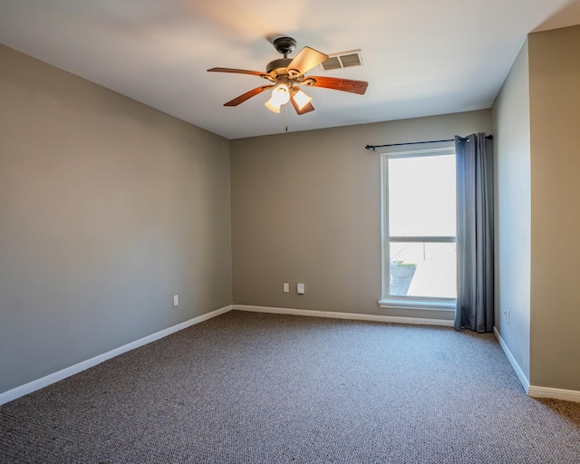 unfurnished room featuring ceiling fan and carpet flooring