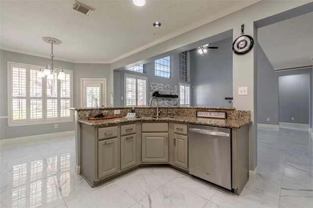 kitchen with sink, stainless steel dishwasher, ceiling fan with notable chandelier, dark stone counters, and crown molding