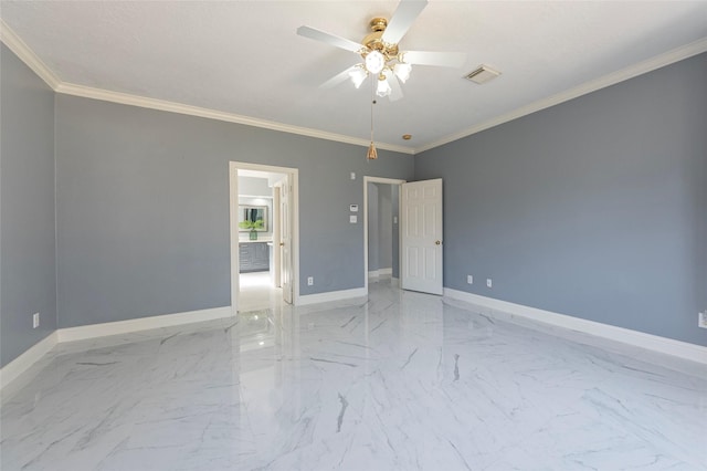 spare room featuring ceiling fan and crown molding