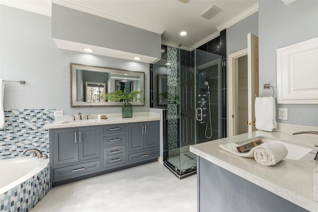 bathroom featuring tile patterned floors, crown molding, vanity, and shower with separate bathtub