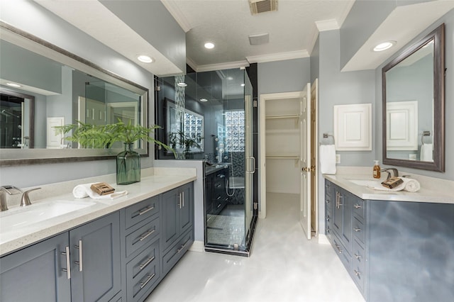 bathroom with ornamental molding and vanity