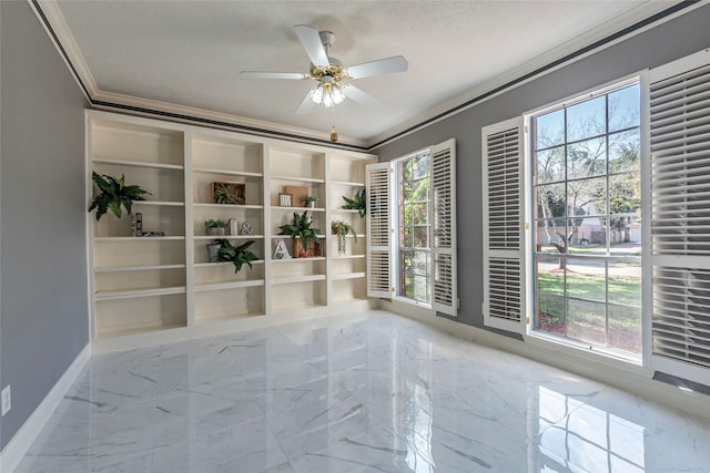 spare room with a textured ceiling, ceiling fan, and ornamental molding