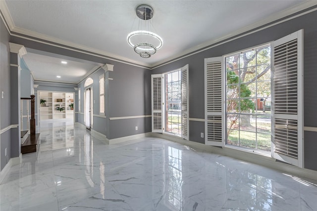 unfurnished room featuring ornamental molding and a healthy amount of sunlight