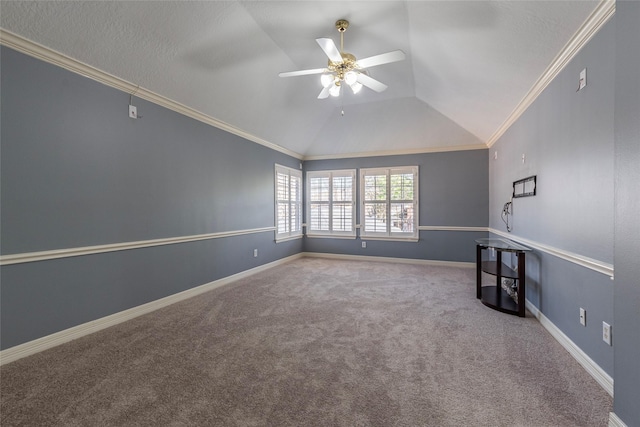 unfurnished room featuring ceiling fan, ornamental molding, lofted ceiling, and carpet